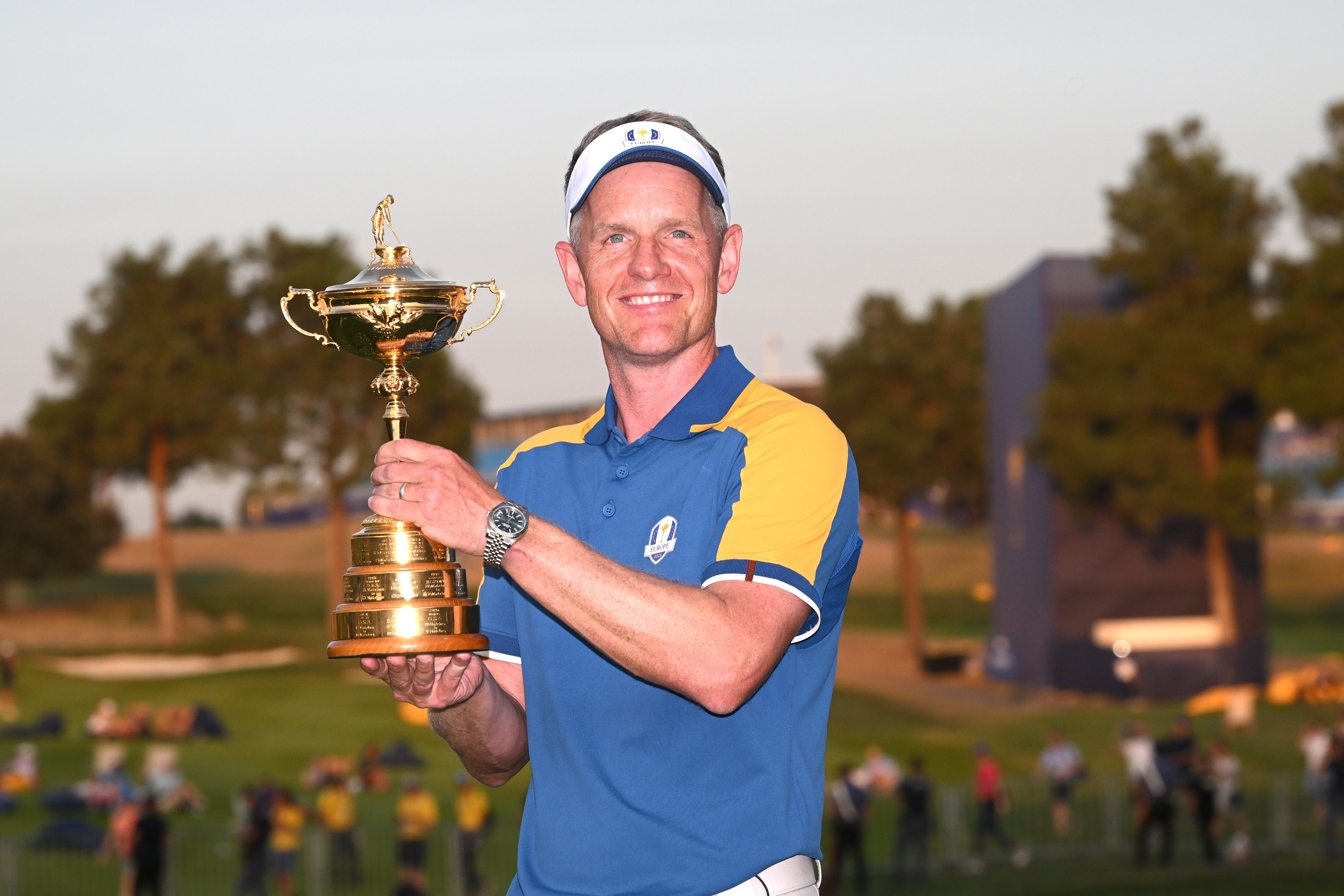 Luke Donald celebrates with the Ryder Cup trophy
